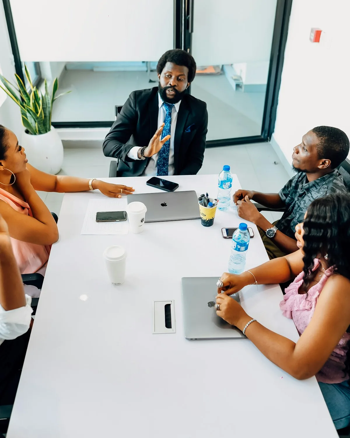 Leaders around a table in a staff meeting